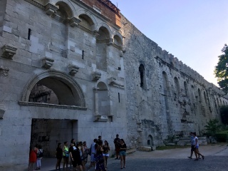 The long Palace wall. Two thousand years of arched windows.