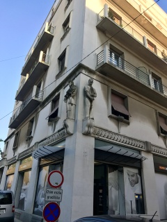 A stone soldier guarding a street corner. Split has standards.