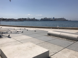 The Riva. Cruise ships parked across the water.