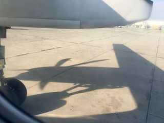Prop shadow on the apron. First leg in a little turboprop.