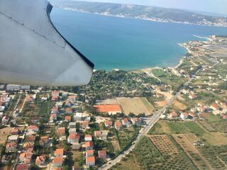 Bye, Croatia. Red roofs and turquoise water from the turboprop.