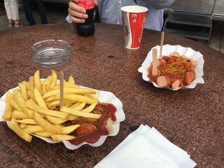 Currywurst, fries, and serious mustard. The proper way to spend a layover.