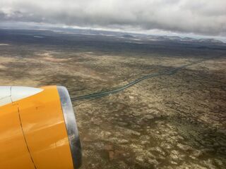 Iceland's lava fields and one lonely road on the way up.