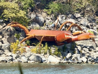 In the distance, a giant metal crab