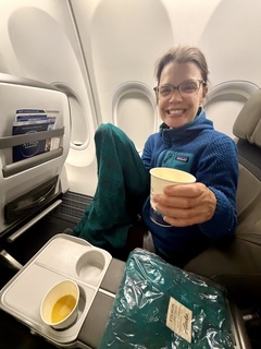 The front of the plane. Nothing but blankets and sparkling wine